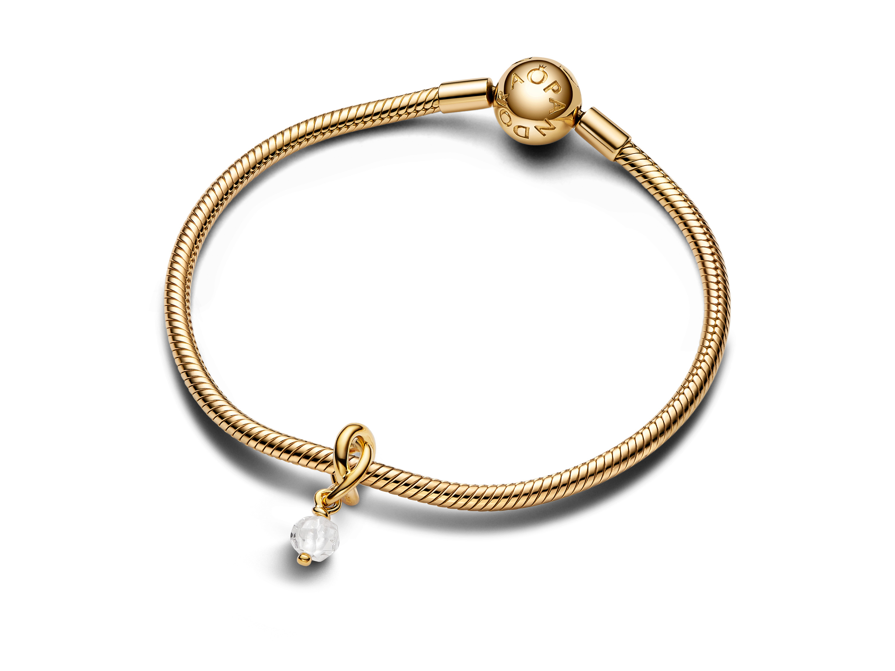 Zartes Armband aus gelbgoldvergoldetem Material mit einer klaren Zirkonia-Anhänger, ideal für stilvolle Akzente, Hersteller Pandora, Modell SHINE, Monatsstein April.