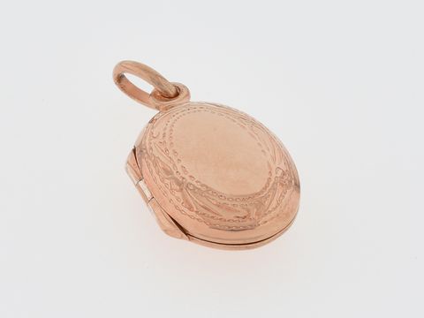 Silber Medaillon oval in silber rosé vergoldet mit filigranem Rand, Hersteller Juwelier Harnisch, elegant und zeitlos für besondere Anlässe geeignet.