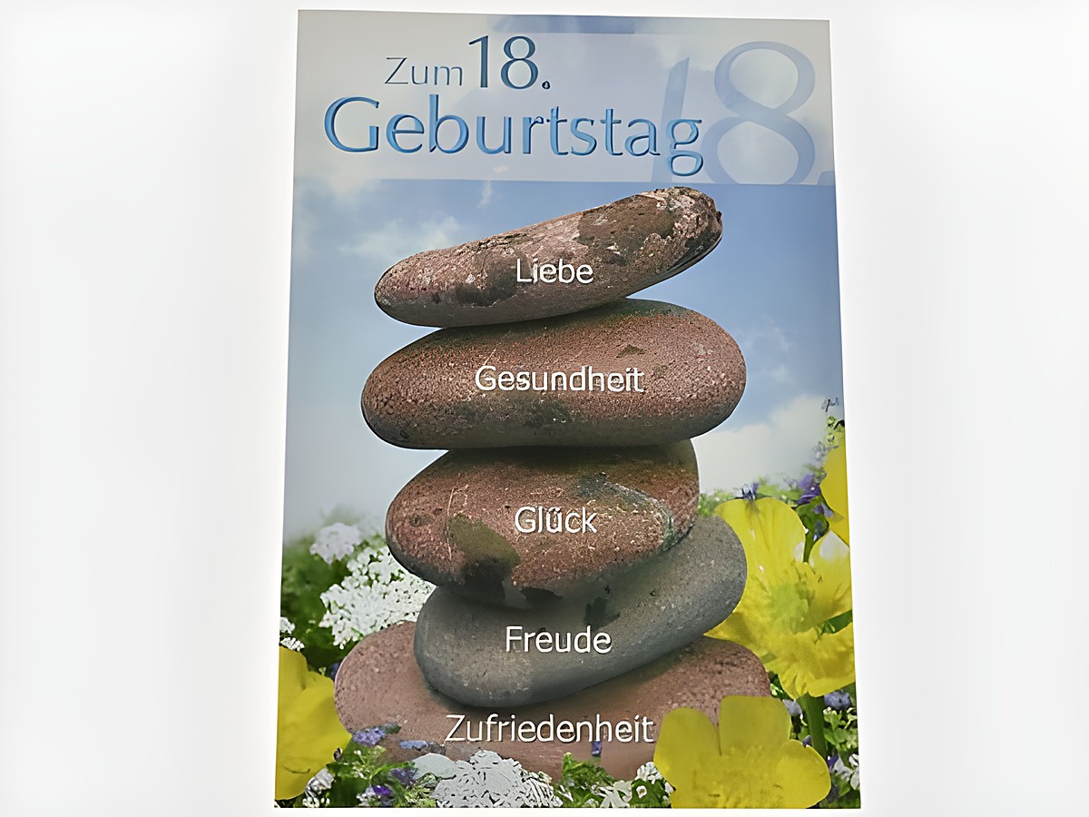 Eine Geburtstagskarte zum 18. Geburtstag mit einem bunten Hintergrund und gestapelten Steinen, auf denen die Worte Liebe, Gesundheit, Glück, Freude und Zufriedenheit geschrieben stehen. Hersteller: Juwelier Harnisch.