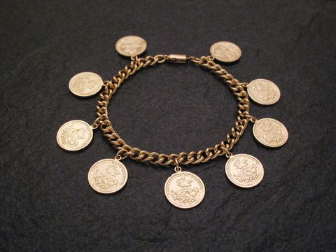 Armband goldfarben mit Münzoptik, Hersteller Juwelier Harnisch, aus massivem Material mit mehreren charmanten Münzanhängern, ideal für eleganten und modischen Schmuck.
