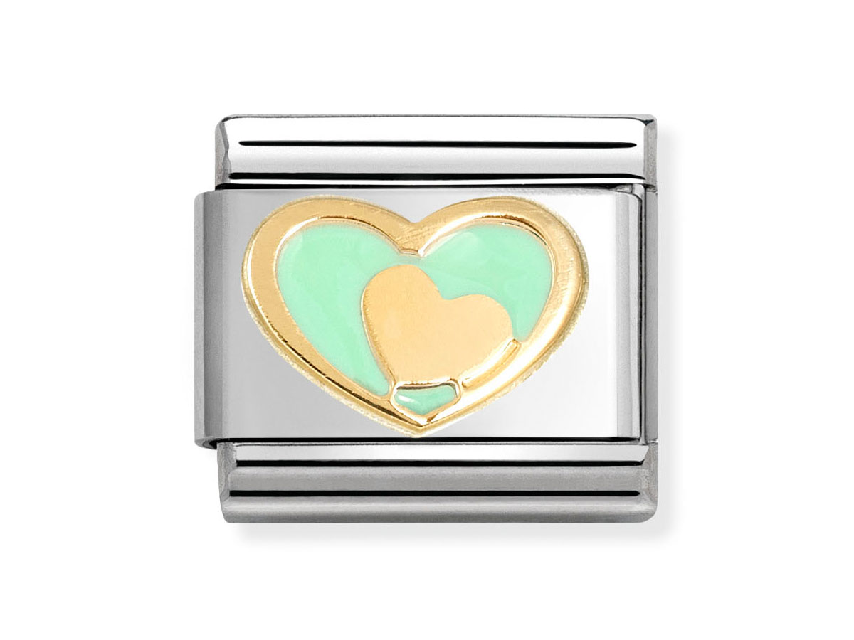 Ein herzförmiges Element aus 585 Gelbgold mit pastellgrüner Emaille, das ein Herz in einem Herzen darstellt, eingefasst in einem silbernen Gehäuse von Nomination, Neuheiten.