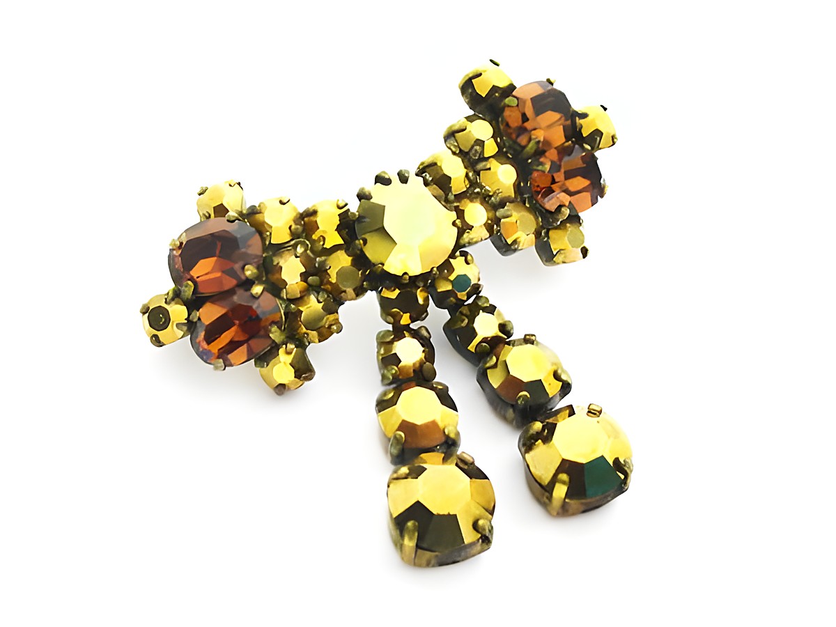 Goldige Strass Damen Brosche im Sexy City Look von Juwelier Harnisch, gefertigt aus gelben und braunen Strasssteinen, optimal für elegante Outfits und besondere Anlässe.