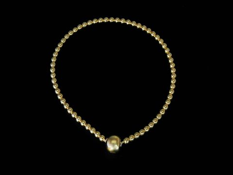 30951-0 Silbernes Stretch-Armband mit vergoldeten Kugeln in einer Länge von 18 cm, hergestellt von Juwelier Harnisch, ohne Stein.