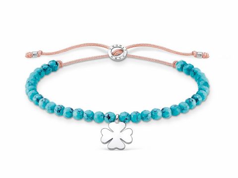 Silbernes Armband aus der Thomas Sabo Charming Collection mit Kleeblatt-Anhänger, verziert mit türkisfarbenen Nylonperlen, einstellbar von 13 bis 20 cm.