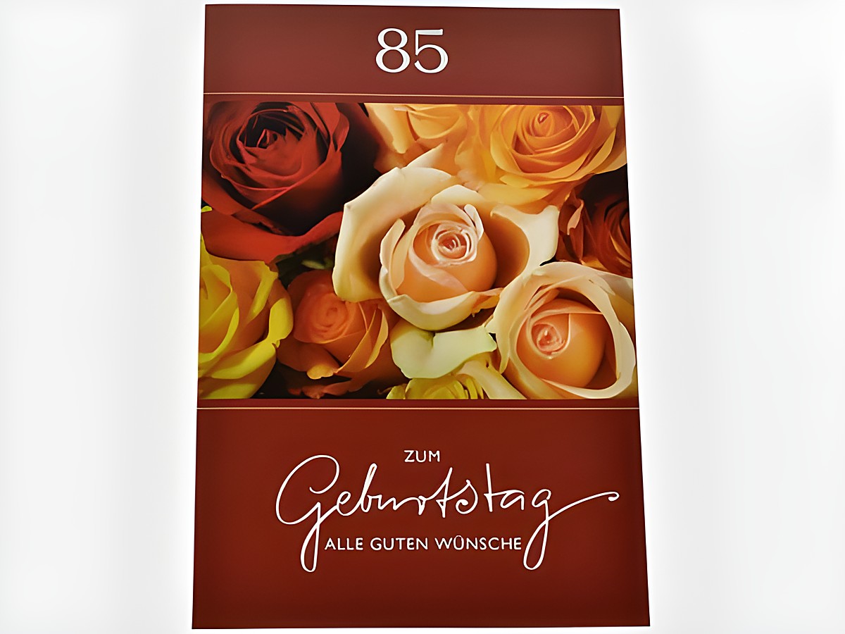 Geburtstagskarte mit farbenfrohen Rosenblüten in verschiedenen Nuancen, darunter rote und gelbe Rosen, mit dem Text zum Geburtstag alle guten Wünsche und der Zahl 85, Hersteller Juwelier Harnisch.