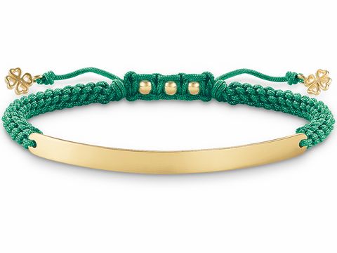 Makramee Armband in grünem Nylon mit vergoldetem Edelstahlschild, von Thomas Sabo. Verstellbar von 15 bis 21 cm, verziert mit kleinen goldenen Elementen.