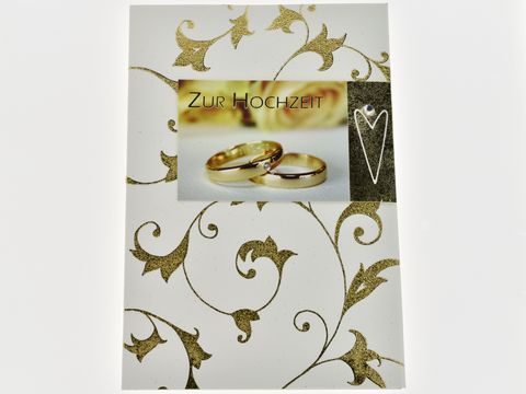 Hochzeitskarte mit goldenen Ranken, Hersteller Juwelier Harnisch, zeigt die Aufschrift Zur Hochzeit und zwei goldene Eheringe im Bildvordergrund, elegante und festliche Gestaltung.
