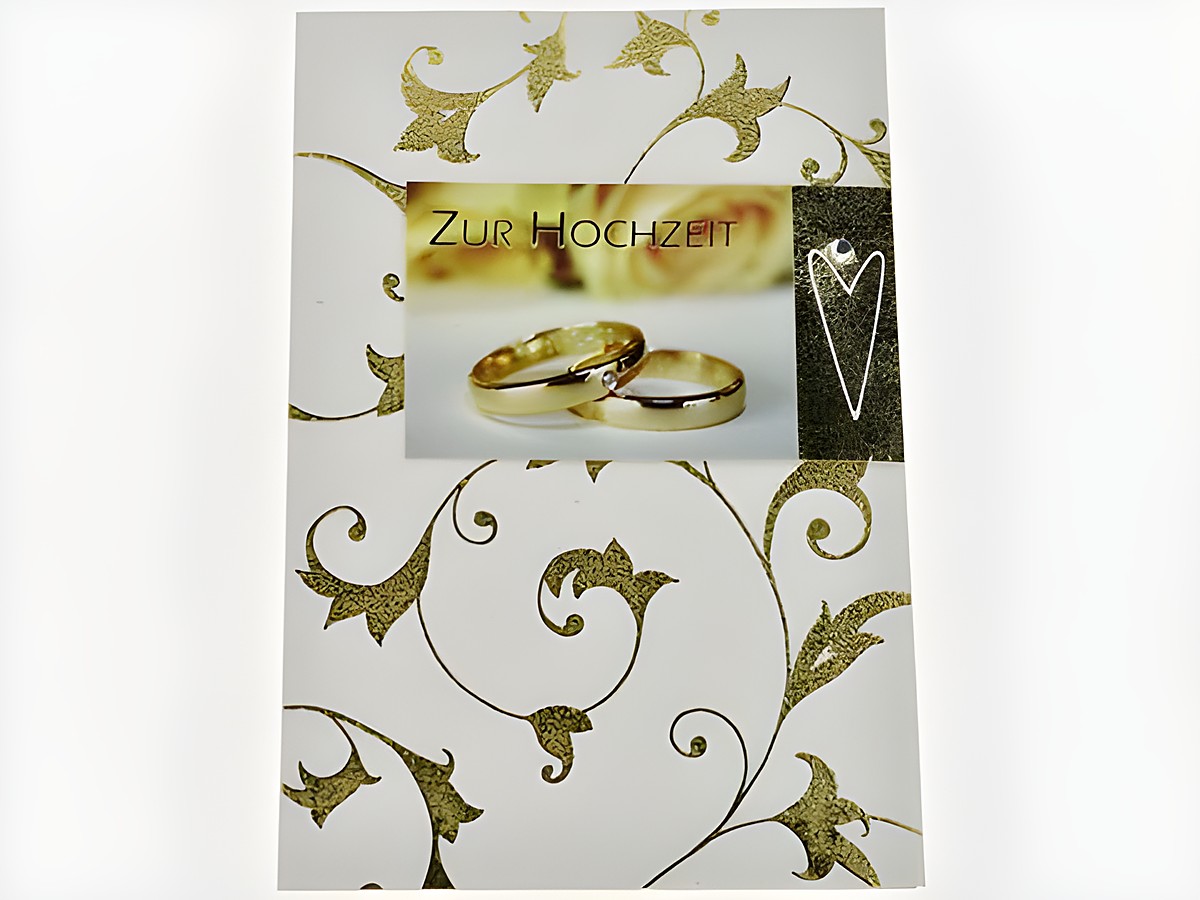 Hochzeitskarte mit goldenen Ranken, Hersteller Juwelier Harnisch, zeigt die Aufschrift Zur Hochzeit und zwei goldene Eheringe im Bildvordergrund, elegante und festliche Gestaltung.