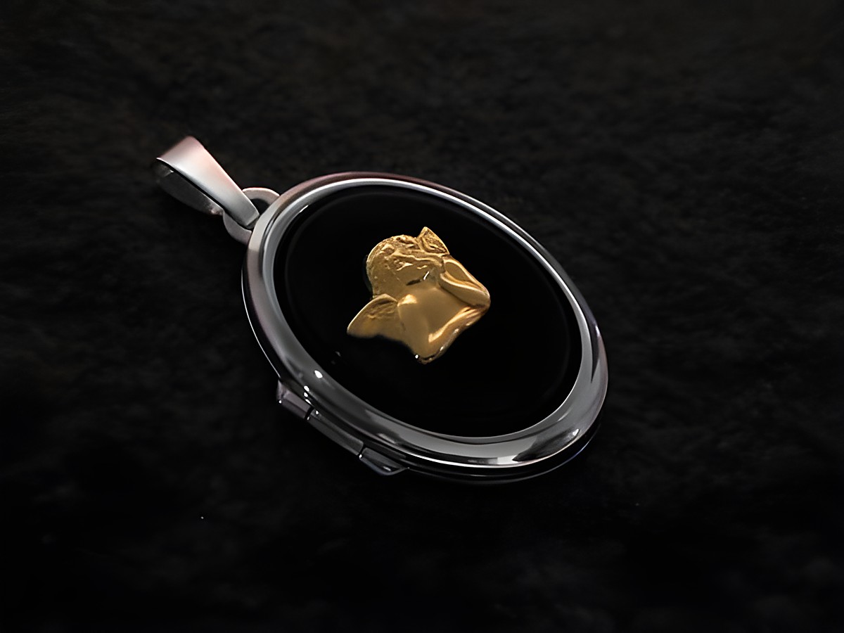 Ein filigranes Medaillon aus Weißgold 585 mit einer Engel Onyx Darstellung und einem goldenen Engelmotiv. Ideal als Schmuckstück für besondere Anlässe.