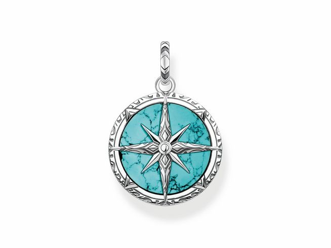 Ein Thomas Sabo Anhänger aus Sterling Silber mit einem geschwungenen Design und imitierten Türkis. Der Anhänger zeigt einen Kompass mit feinen Details und einem zentralen Stein.