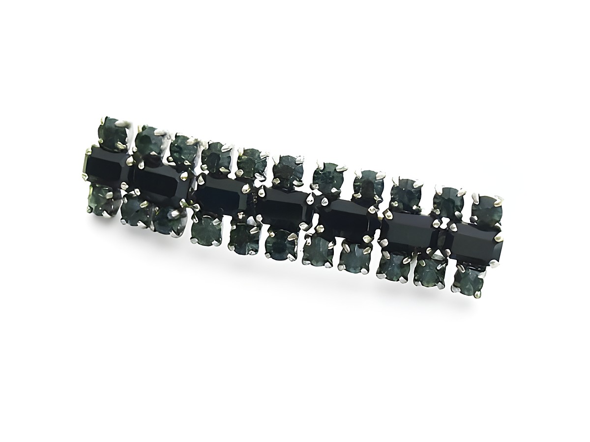 Strass Brosche in blau mit gefassten Steinen, elegant und super sexy, hergestellt von Juwelier Harnisch. Ideal für stilvolle Akzente und festliche Anlässe.