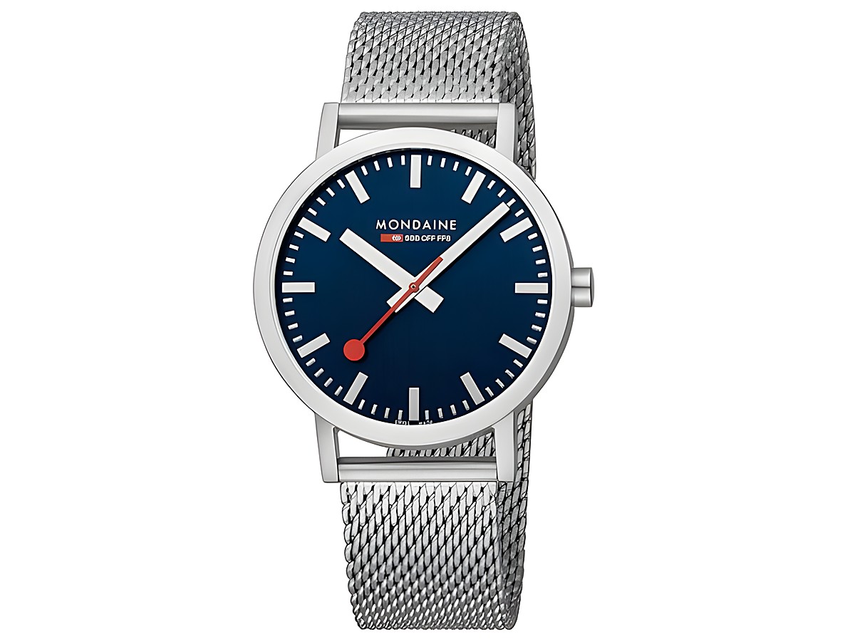 Die Mondaine Uhr Classic A660.30360.40SBJ verfügt über ein Ozeanblaues Ziffernblatt und ein elegantes Metallarmband in Silber. Sie hat ein modernes Design mit klaren Linien und kontrastierenden Details.