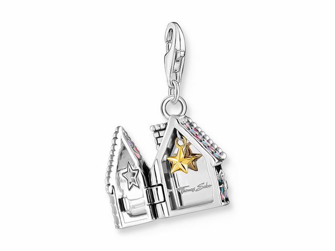 Charm-Anhänger von Thomas Sabo in Form eines Lebkuchenhauses aus geschwärztem Silber mit Glas-Keramik Stein und goldenem Stern. Ideal für festliche Anlässe oder als Schmuckstück.