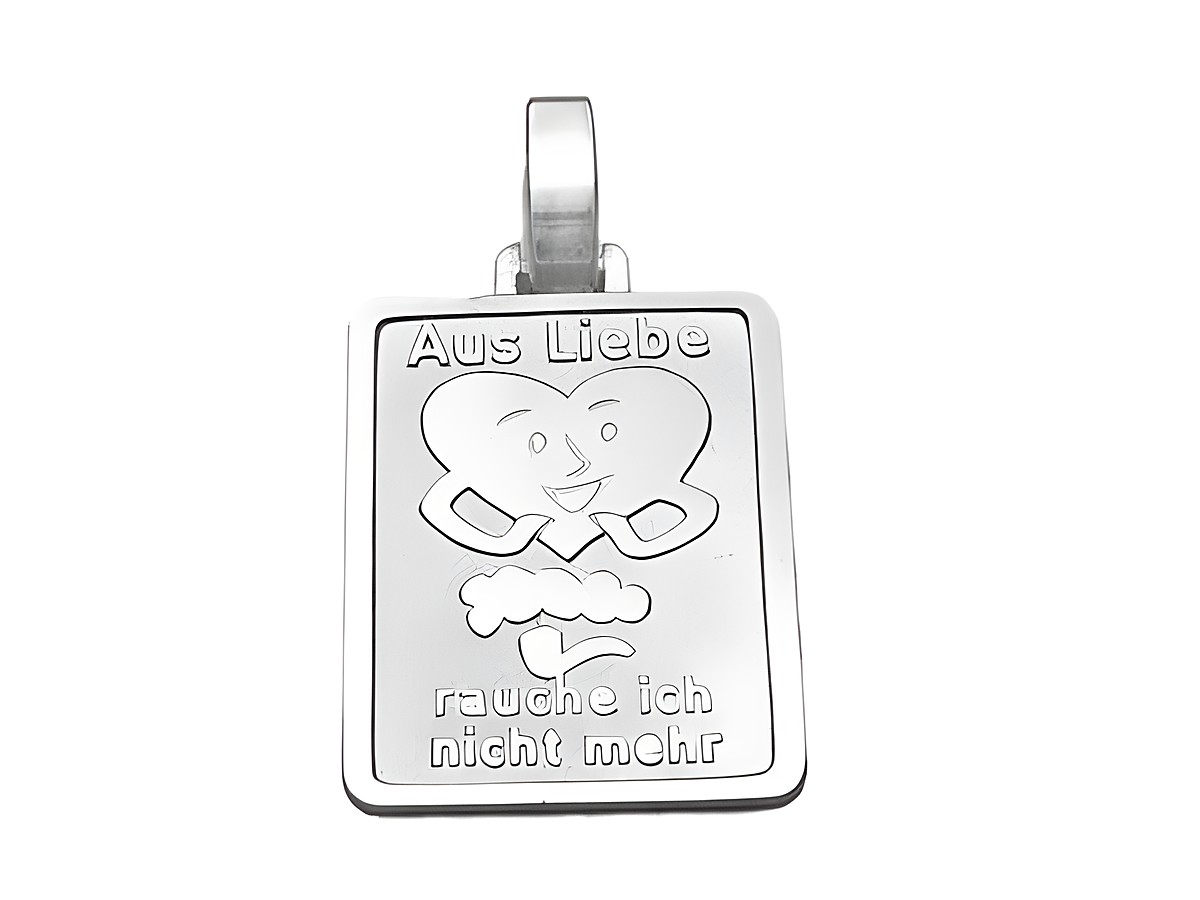 Silber Anhänger mit dem Motiv Aus Liebe rauche ich nicht mehr, gefertigt vom Juwelier Harnisch, zeigt ein lächelndes Herz und eine aufsteigende Rauchwolke.