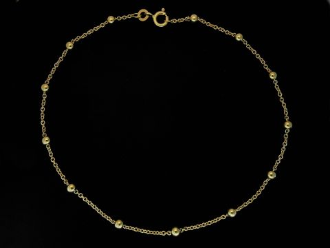 Fußkettchen aus 333 Gold, mit Rundankern und Kügelchen, versehen mit einem Federring, Länge 25 cm, hergestellt von Juwelier Harnisch, elegant und zeitlos in Design.