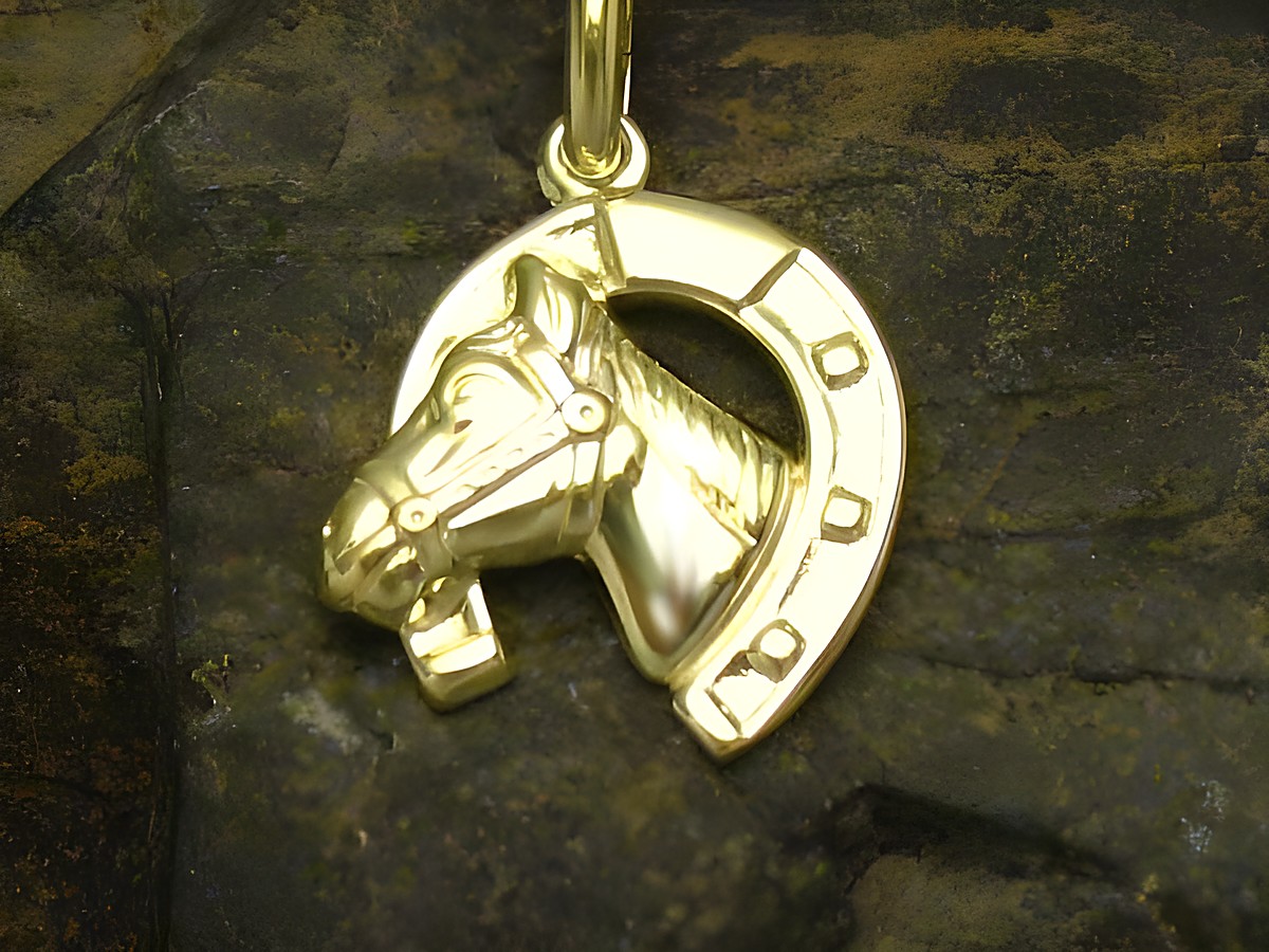 Anhänger in Form eines Hufeisens mit einem Pferdekopf aus Gold von Juwelier Harnisch, symbolisiert Glück und ist ein schöner Glücksbringer für Tierliebhaber.