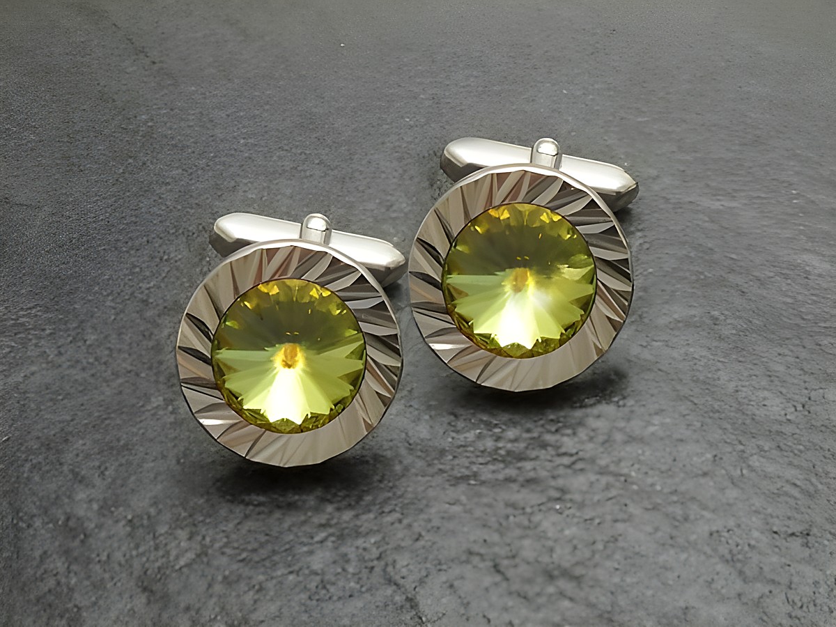 Strass Manschettenknöpfe in EINZELSTÜCK mit buntem, geschliffenem Stein in leuchtendem Gelb, hergestellt von Juwelier Harnisch, umrahmt von einem eleganten, verschnörkelten Design.