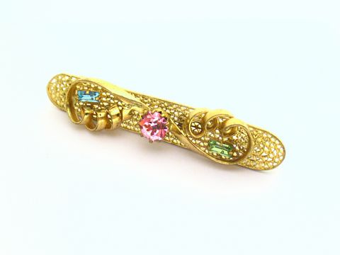 Strass Brosche - Wunderschön - Bunt & Gefasst - NEU - Hersteller: Juwelier Harnisch, eine elegante goldene Brosche mit bunten Strasssteinen in verschiedenen Farben.
