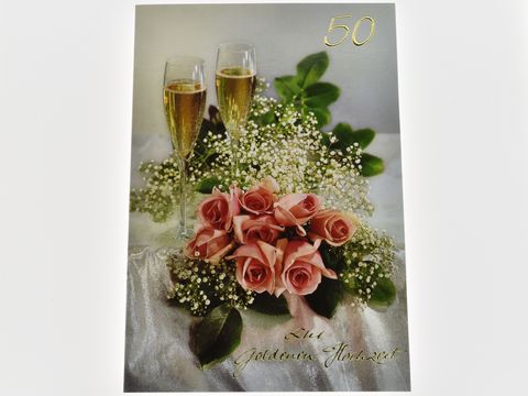 Hochzeitskarte mit zwei Sektgläsern, einem Blumenstrauß aus rosa Rosen und Schleierkraut, gestaltet von Juwelier Harnisch, ideal für den Anlass der goldenen Hochzeit.