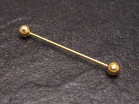 Vergoldete Kragennadel mit Kugeln, hergestellt von Juwelier Harnisch, ideal für das Befestigen von Kragen oder als stilvolles Accessoire. Elegantes Design und glänzende Oberfläche.