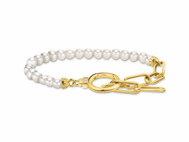 Elegantes Gliederarmband aus silber vergoldetem Material, verziert mit weißen Perlen und Zirkonia, Hersteller Thomas Sabo, Modell A2134-445-14-L19V, Länge 19 cm.