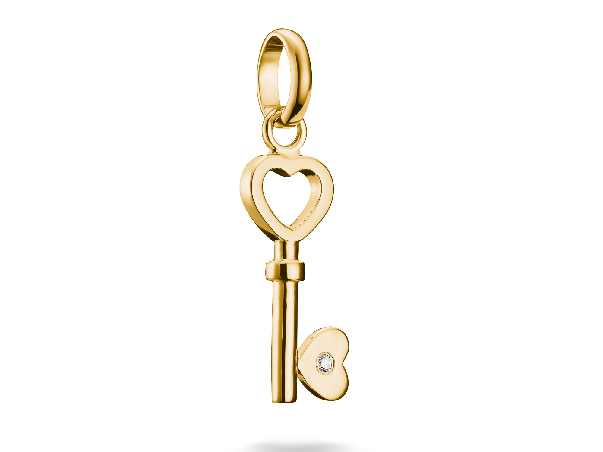 Charm in Form eines Liebesschlüssels aus Silber und vergoldetem Material, verziert mit einem Zirkonia. Der Schlüssel hat eine Herzöffnung und ist Teil der Thomas Sabo Charm Club Kollektion.
