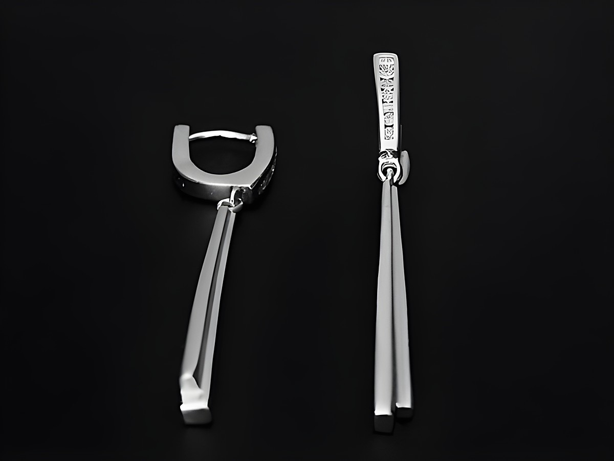 Elegante rhodinierte Ohrhänger von Juwelier Harnisch mit Zirkonia-Steinen, gefertigt in Silber, verleihen jedem Look einen Hauch von Glamour und Stil.