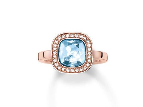 Ring aus Sterling Silber in vergoldetem Roségold, besetzt mit synthetischem Spinell und Zirkonia, in Größe 54. Der Ring zeichnet sich durch einen blauen Stein und funkelnde Akzente aus.