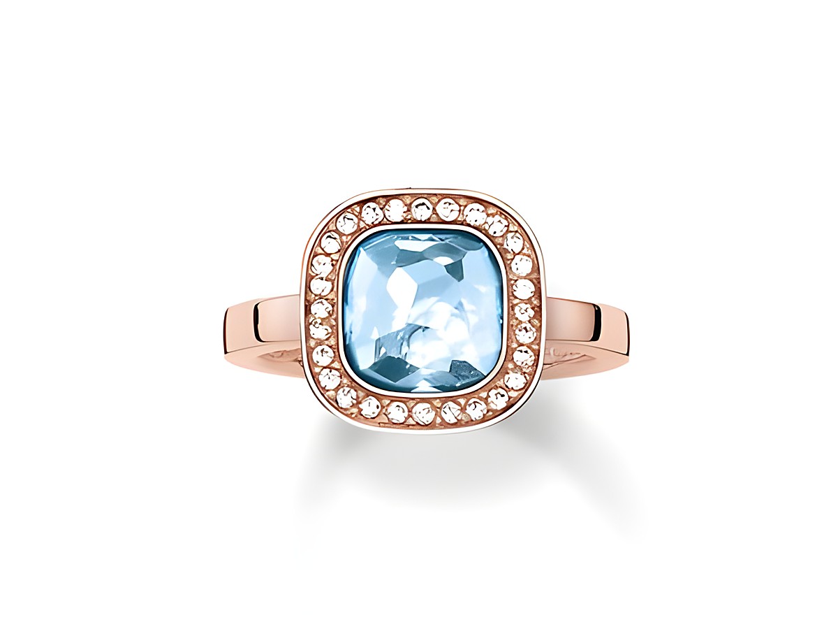 Ring aus Sterling Silber in vergoldetem Roségold, besetzt mit synthetischem Spinell und Zirkonia, in Größe 54. Der Ring zeichnet sich durch einen blauen Stein und funkelnde Akzente aus.