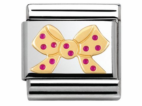 Edelstahl Charm von Nomination MADAME ET MONSIEUR mit einer goldenen Schleife und rosafarbenen Kügelchen auf einem silbernen Hintergrund.