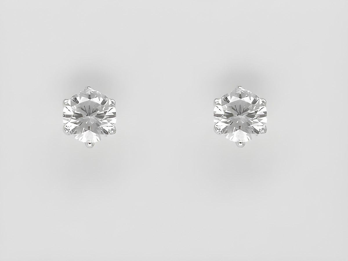 Weißgold Ohrringe in Krappenfassung mit zauberhaftem Brillant 0,25 ct. W/Si Stecker von Juwelier Harnisch, elegant und zeitlos, ideal für jeden Anlass.