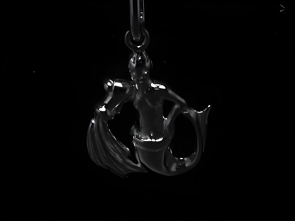 Wassermann Sternzeichen Anhänger aus rhodiniertem 925 Sterling Silber, dargestellt als stilisierte Figur mit Wasser und Wellen, elegant und modern, Hersteller Juwelier Harnisch.