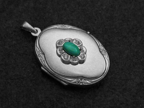 Türkis Medaillon Cabochon aus Sterling Silber mit Brillanten, kunstvoll gearbeitete Oberfläche und florales Design, Hersteller Juwelier Harnisch. Ideal als elegantes Schmuckstück.