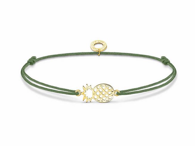 Thomas Sabo Armband in Sterling Silber mit vergoldetem Ananas-Element, grünem Nylonband und Zirkonia, verstellbar von 14 bis 20 cm. Ideal für modische Akzente.
