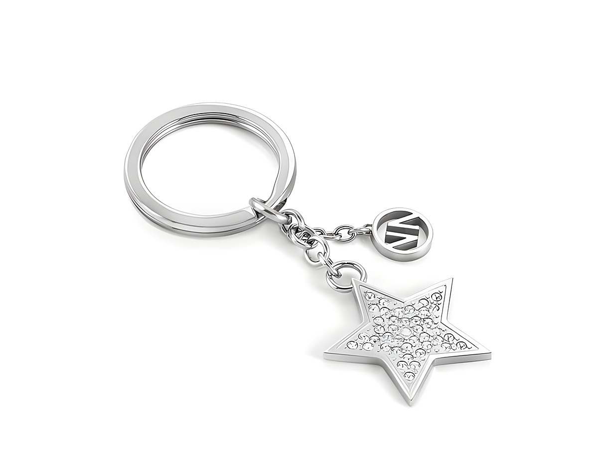 Edelstahl Schlüsselring mit einem funkelnden Sternanhänger, besetzt mit Kristallen, und einem kleinen Anhänger mit dem Logo des Herstellers Nomination in Silber.
