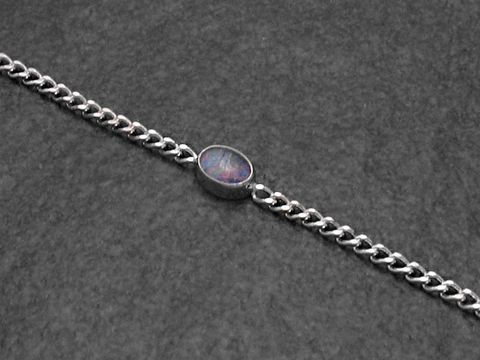 32319-0 Silber Armband 19cm x 7mm mit einem Opal Triplette, gefertigt vom Juwelier Harnisch, bietet eleganten Schmuck mit einem funkelnden Akzent in der Mitte.