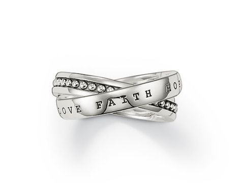 Thomas Sabo Ring TR1930-001-12-56 aus Silber in Größe 56, mit drehenden Elementen, gravierten Wörtern und funkelnden Steinchen, symbolisiert Liebe, Glauben und Hoffnung.
