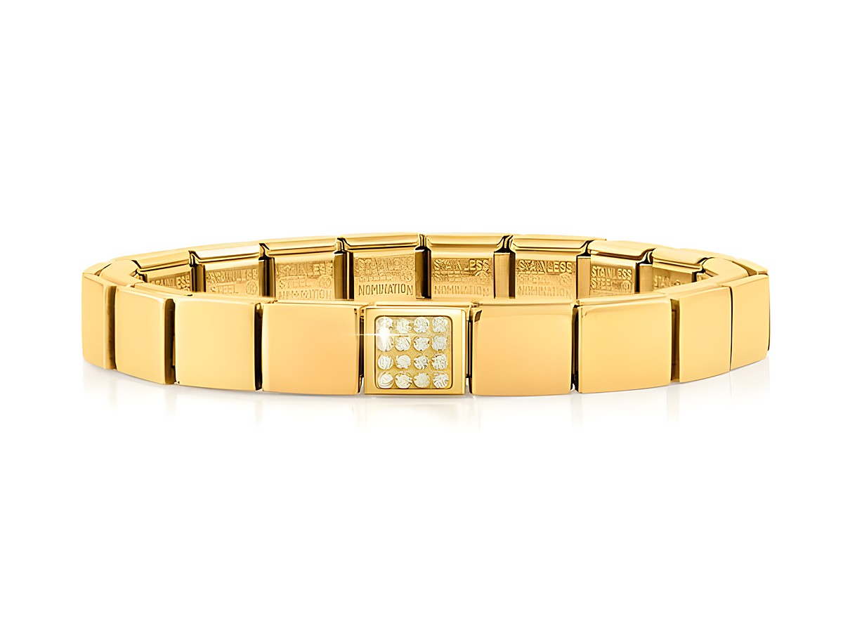 Ein elegantes Armband aus Edelstahl in PVD Gelbgold mit einem funkelnden Kristallelement in der Mitte, das stilvoll und modern wirkt, ideal für jeden Anlass.