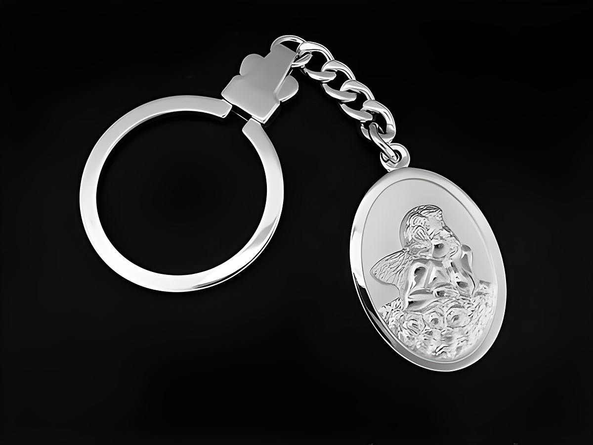Schlüsselanhänger Engel Amor aus rhodiniertem Sterling Silber von Juwelier Harnisch, eine tolle Geschenkidee, zeigt eine detailreiche Gravur eines Engels mit Rosen.
