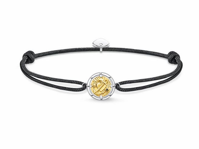 Schwarzes Nylonarmband mit einem vergoldeten, runden Anhänger aus Sterlingsilber und Zirkonia, einstellbare Länge von 16 bis 27 cm, Hersteller Thomas Sabo.