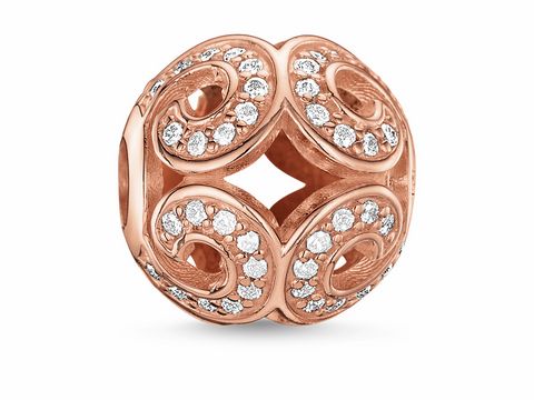 Glitzernde Welle Silber von Thomas Sabo in vergoldetem Roségold mit Zirkonia-Steinen, kunstvoll gestaltete Perle mit geschwungenen Mustern. Ideal für individuelles Schmuckdesign.