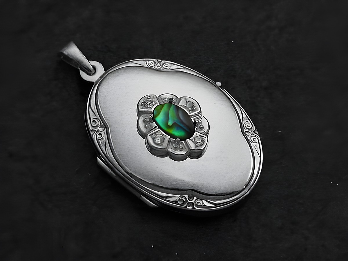Paua Shell Medaillon aus Sterling Silber mit Brillanten, ovales Design, zentrale eingebettete Paua Muschel, kunstvoll verziert, Hersteller Juwelier Harnisch, luxuriöses Schmuckstück.