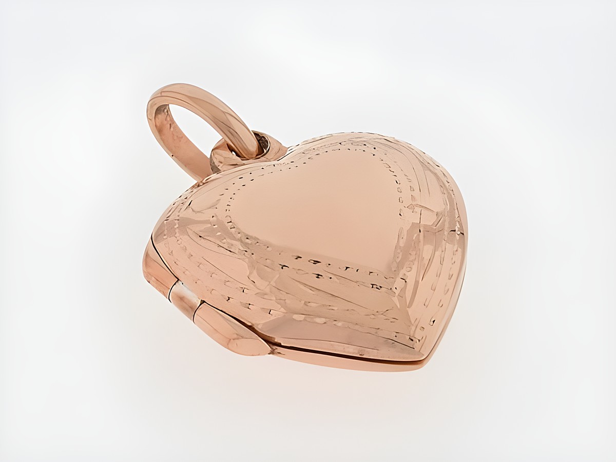 Silber Medaillon in Herzform, silber rosé vergoldet mit filigranem Rand, Hersteller Juwelier Harnisch. Elegantes Schmuckstück für besondere Anlässe.