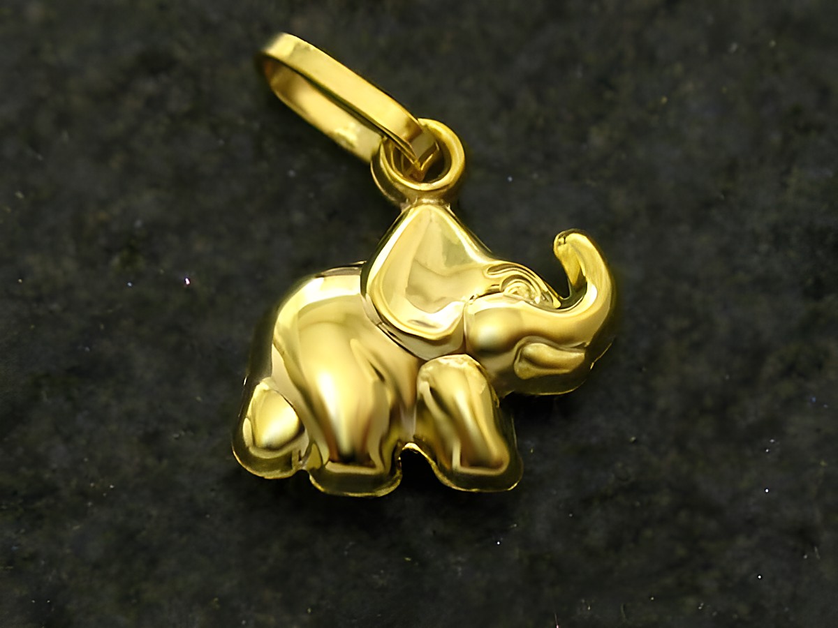 Goldanhänger in Form eines Elefanten, symbolisiert Glück und Stärke, Hersteller Juwelier Harnisch, edles Schmuckstück für Tierliebhaber und Glücksbringer.