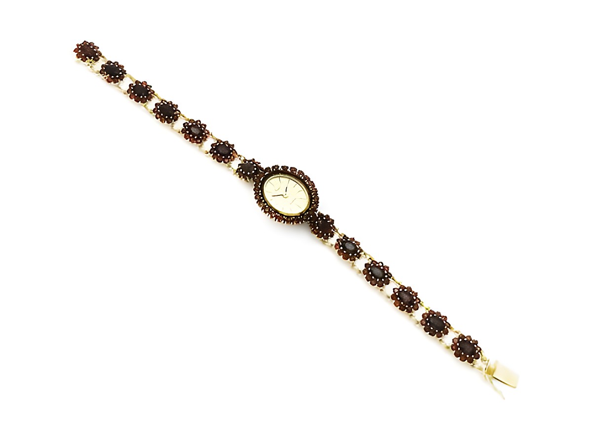 Granat Schmuck Uhr 18 cm mit goldenen Blüten aus Granatschmuck, Hersteller Juwelier Harnisch, verziert mit Stein und Perle, eleganter Zeitmesser im klassischen Design. – Ansicht 2