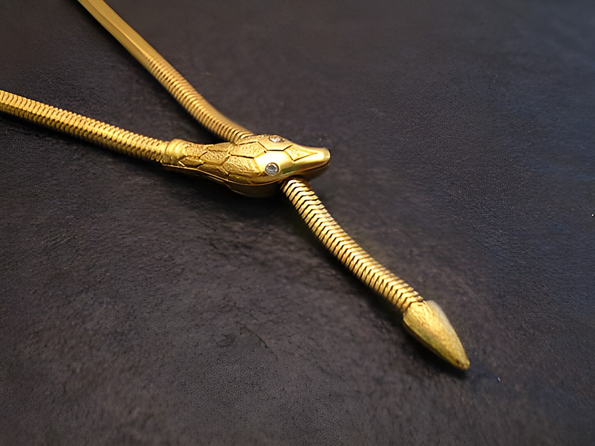 Schlangen Y Kette gut vergoldet 62 cm von Juwelier Harnisch, elegante Design mit Schlangenkopf und -schwanz, ideal für stilvolle Anlässe.