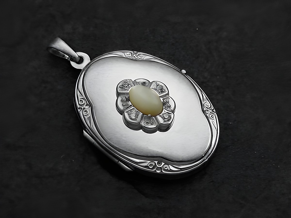 Perlmutt weiß Medaillon Cabochon in Weißgold 585 vom Hersteller Juwelier Harnisch, detailreiche Verzierung mit zentralem Stein und eleganter Anmutung, ideal als Schmuckstück für besondere Anlässe.