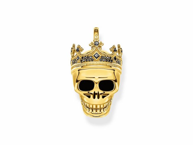 Thomas Sabo Totenkopf-König Anhänger aus vergoldetem Sterlingsilber mit schwarzem Zirkonia. Der Anhänger zeigt einen stilisierten Totenkopf mit einer Krone. Ideal für trendbewusste Schmuckliebhaber.