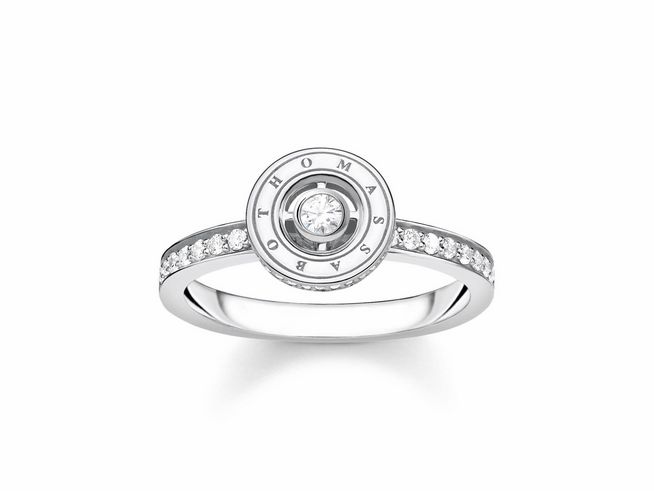 Silberner Ring von Thomas Sabo mit Zirkonia in Weiß, Größe 60, zentrales Motiv mit Markenname und funkelnden Steinchen auf dem Ringband.
