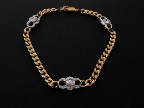 Armband Panzer in Gold 333 bicolor mit Zirkonia, Maße 6,9 x 4,4 mm, Länge 18,5 cm, hergestellt von Juwelier Harnisch, elegantes und funkelndes Design.